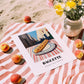 Baguette – White village Outdoor Café Scene, French Food Illustration, unframed on coastal sand