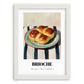 Brioche – on Striped Tablecloth, French Pastry Painting, placed in minimal white frame