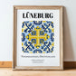 Lüneburg, Germany – Travel Poster, in wooden frame leaning on the floor